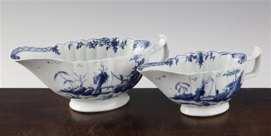 Two Worcester blue and white Fringed Tree pattern fluted sauceboats, c.1758-62, 7in. & 8.25in., the smallest damaged